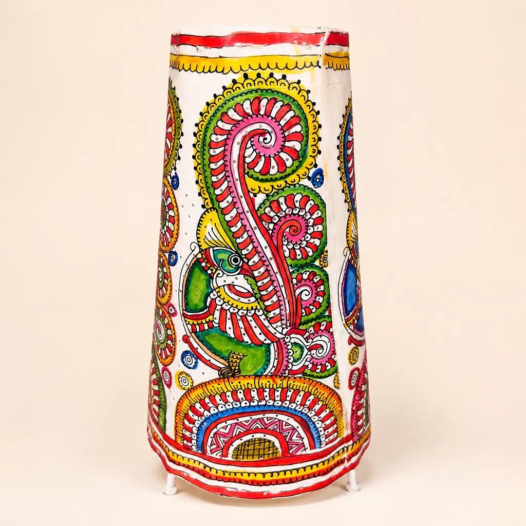 Hand-painted multi-color Tholu Bommalata leather table lamp featuring a green and red peacock motif with intricate swirling tail feathers