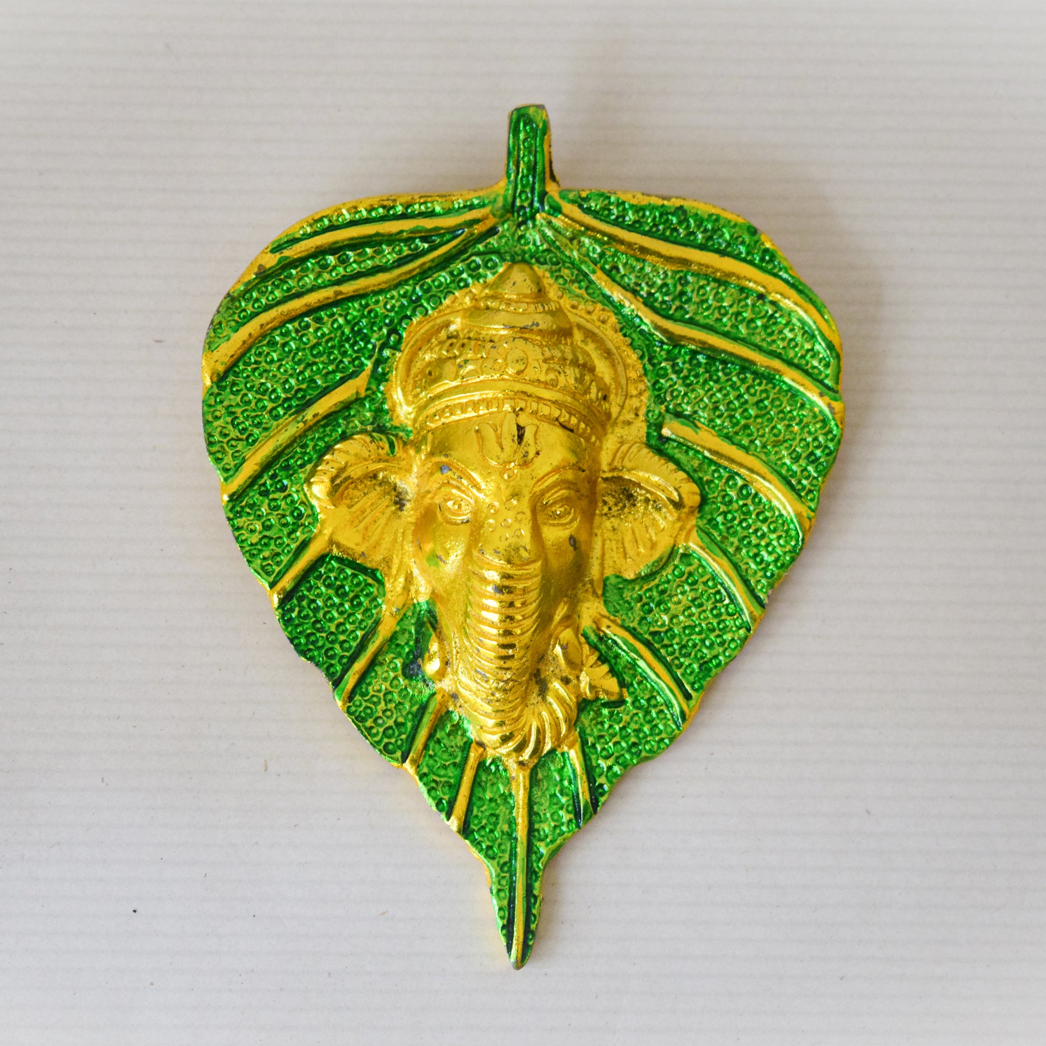 Golden Ganesha Carved on Radiant Peepal