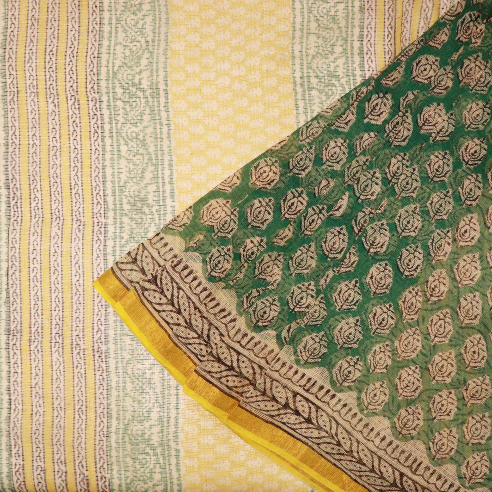 Shop Green Kotadoria saree featuring traditional block print design