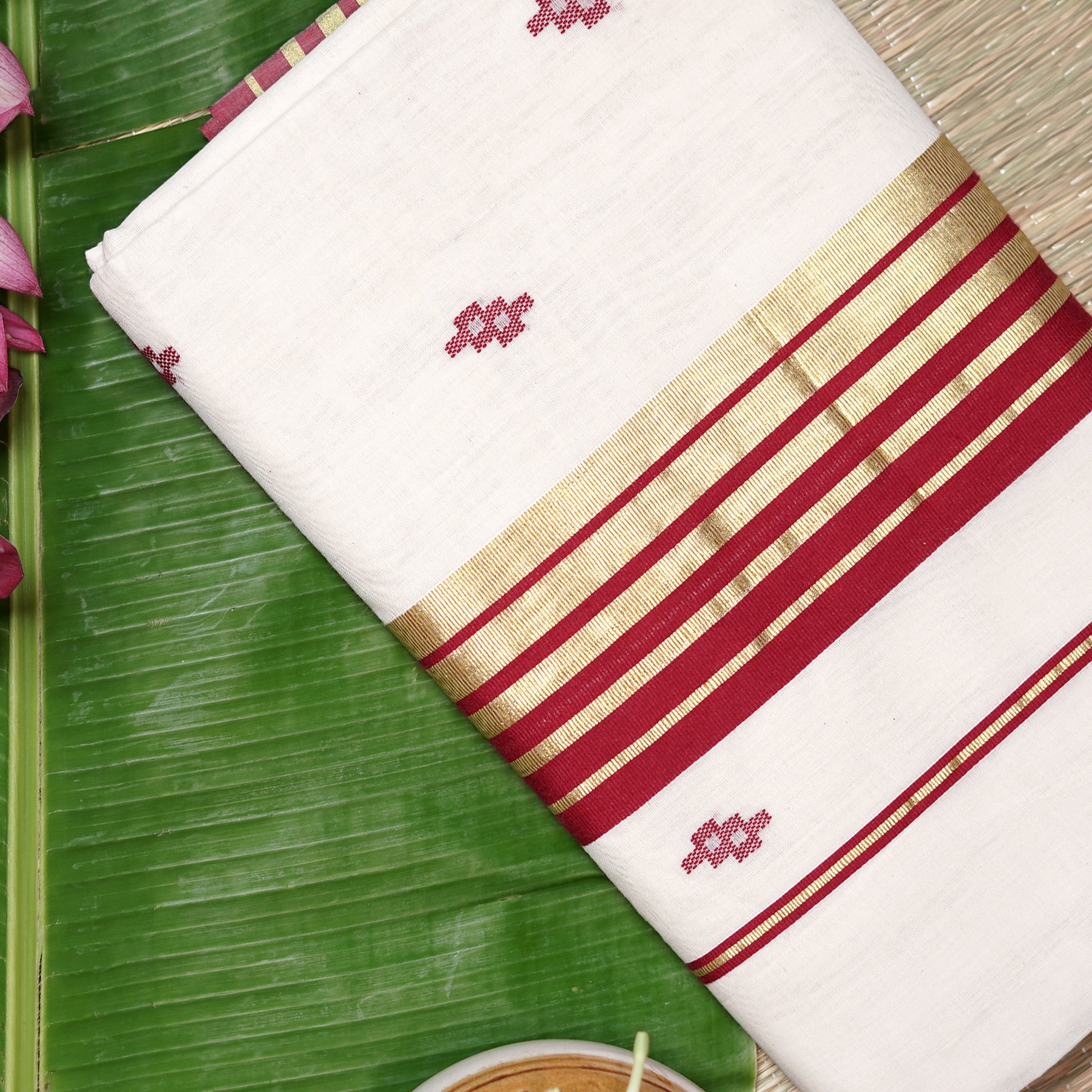 Shop Kasavu White Saree with Red Arai-maadam Motif for a traditional look