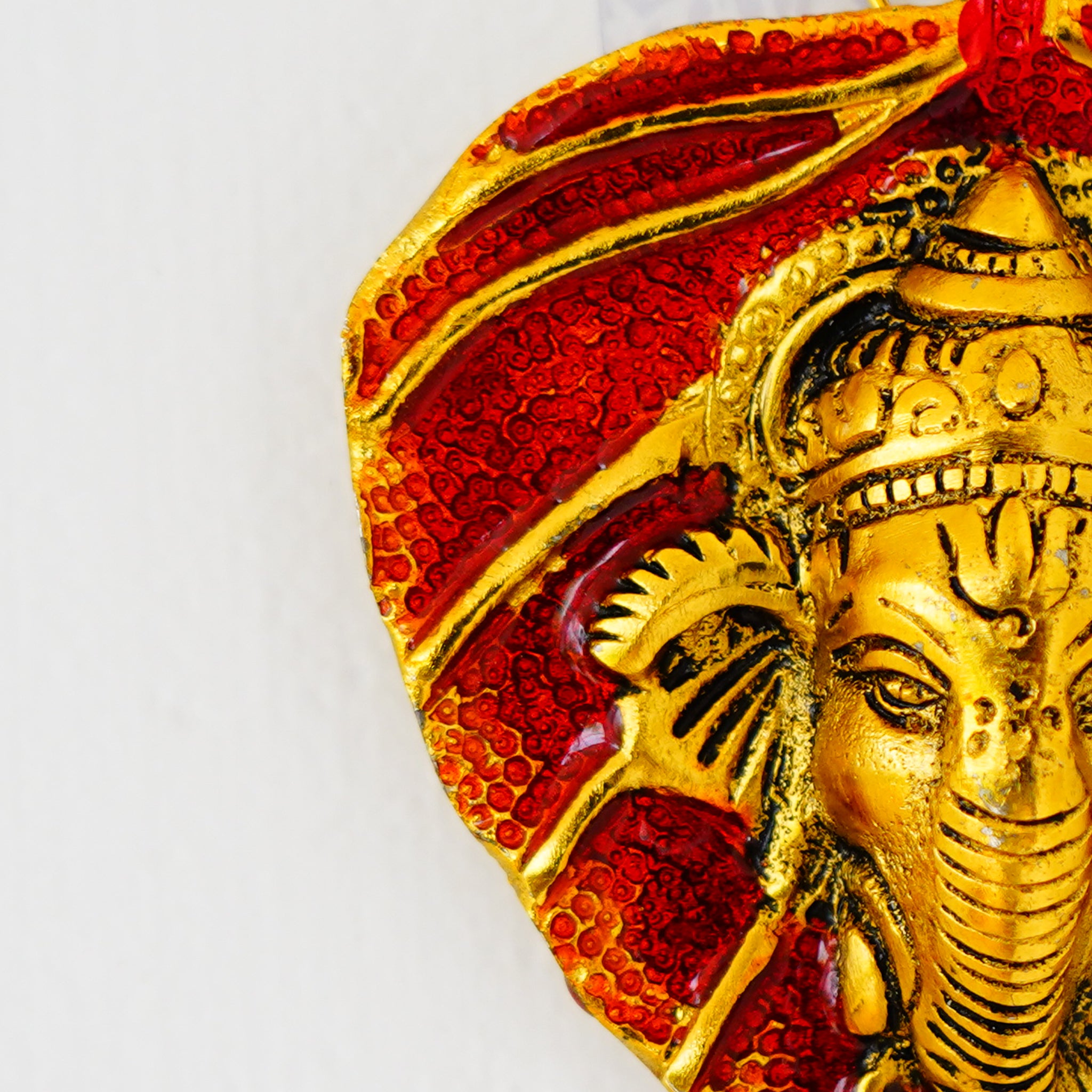 Small Ganesha on Leaf – Red Glazed Decorative Idol (Gillet Metal)
