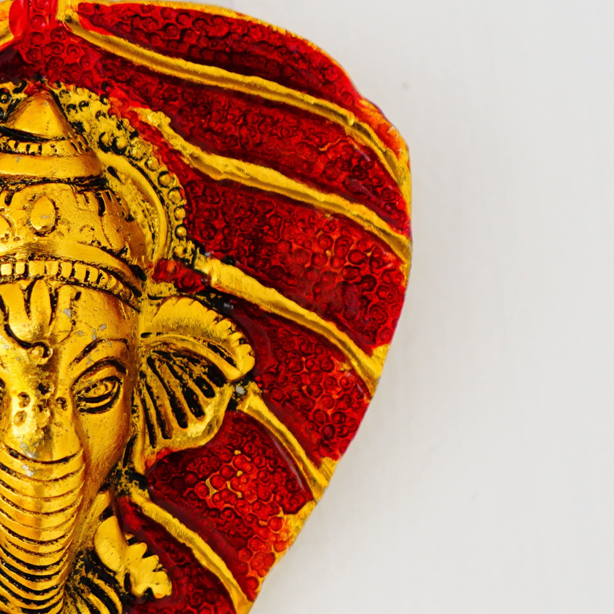 Small Ganesha on Leaf – Red Glazed Decorative Idol (Gillet Metal)