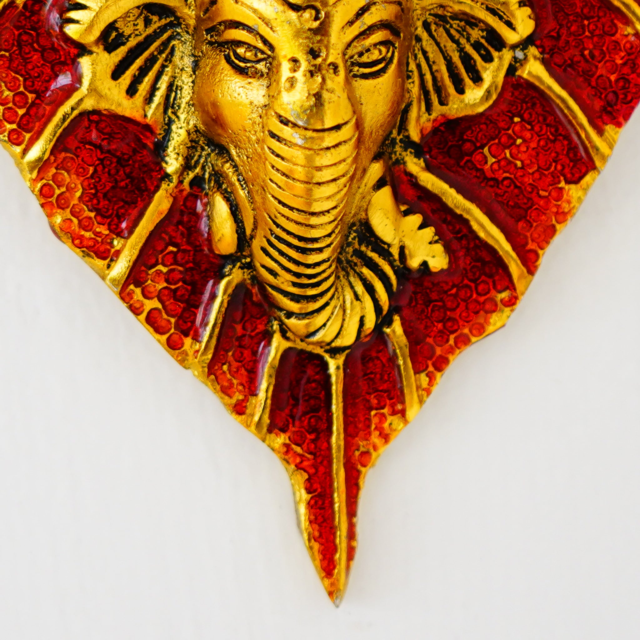 Small Ganesha on Leaf – Red Glazed Decorative Idol (Gillet Metal)