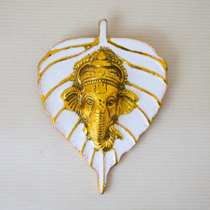 Golden Ganesha Carved on Radiant Peepal