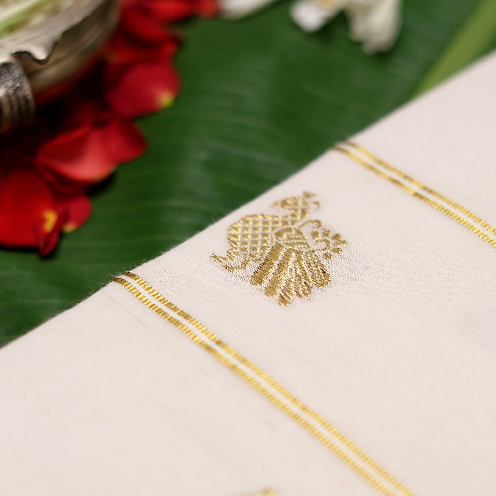 Shop Kerala Kasavu White Saree adorned with Zari Peacock Motif