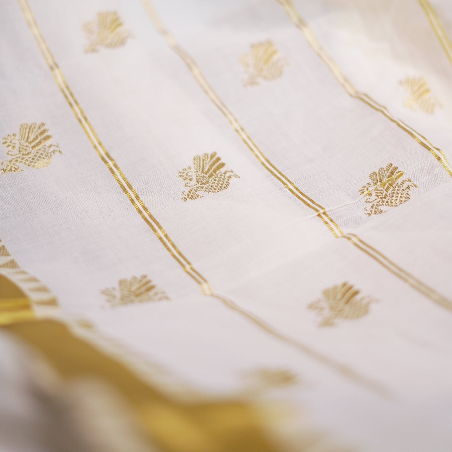 Shop Kerala Kasavu White Saree adorned with Zari Peacock Motif