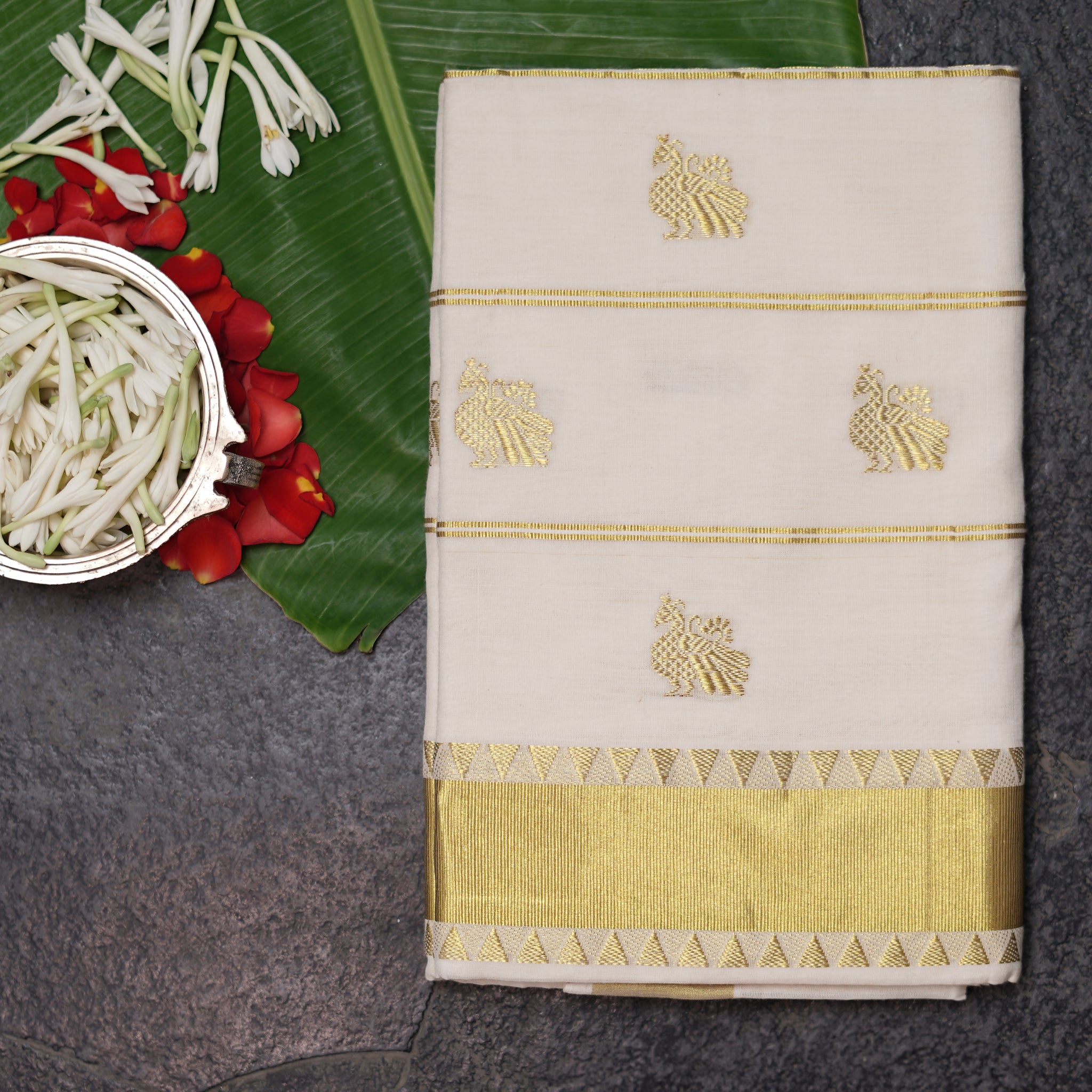 Shop Kerala Kasavu White Saree adorned with Zari Peacock Motif