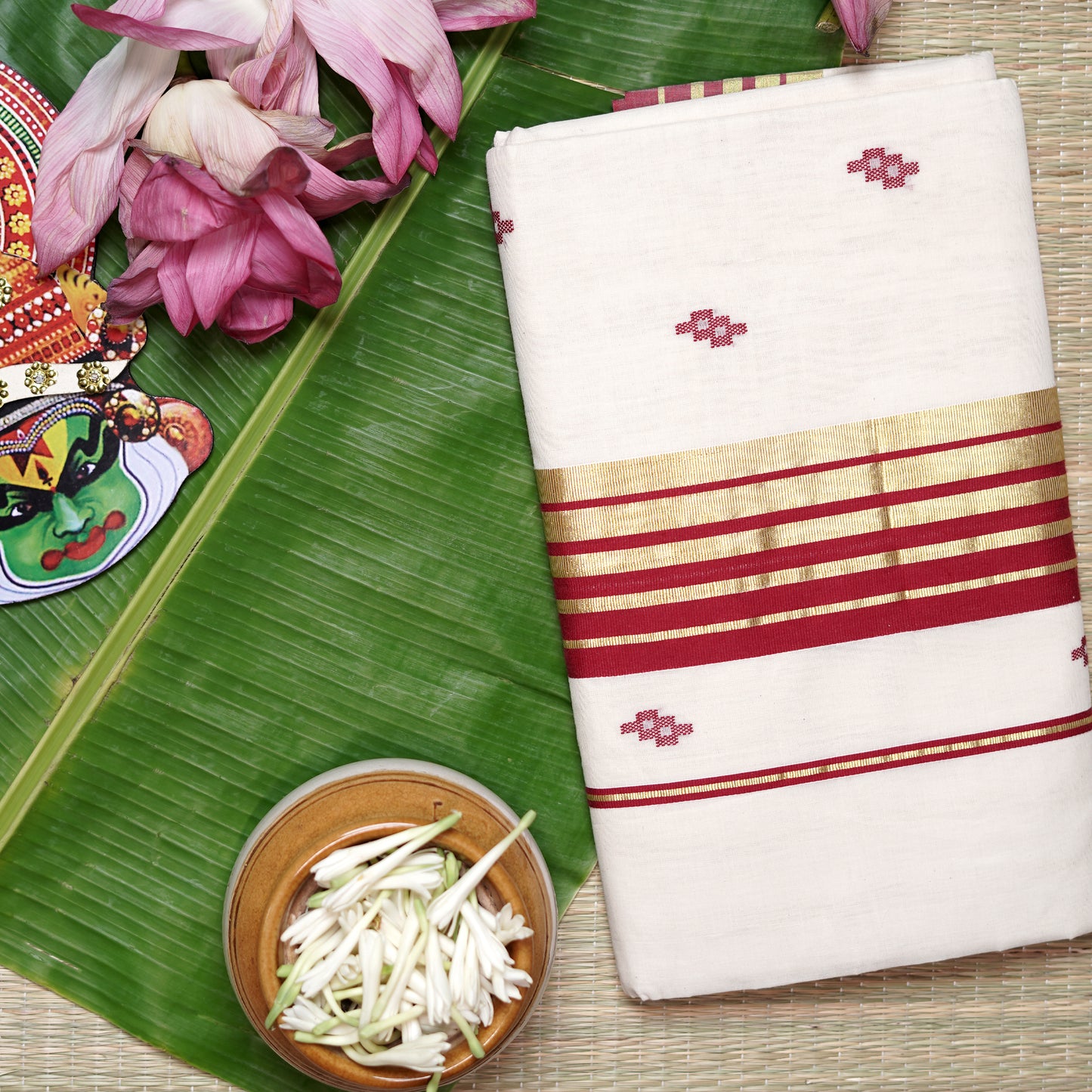 Shop Kasavu White Saree with Red Arai-maadam Motif for a traditional look