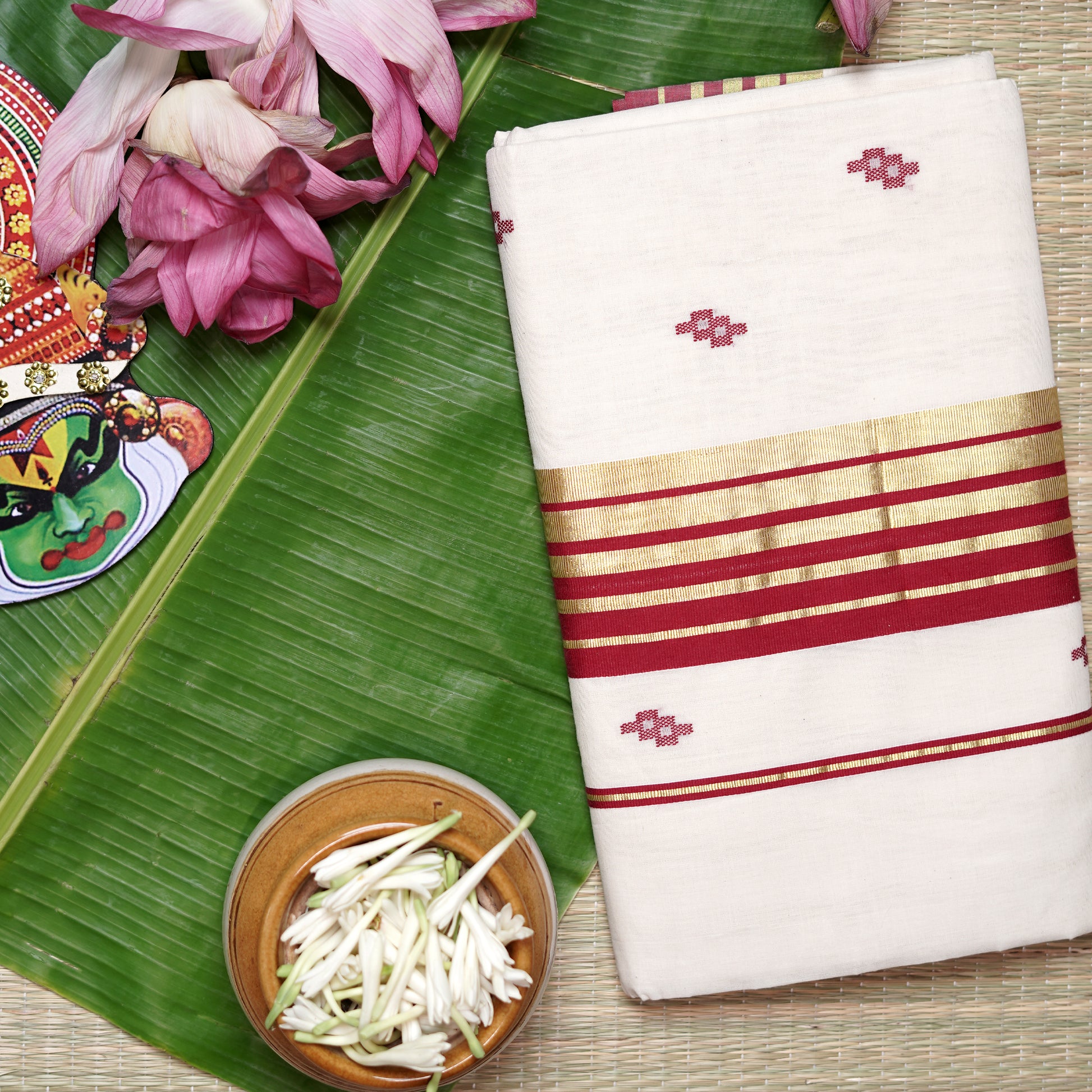 Shop Kasavu White Saree with Red Arai-maadam Motif for a traditional look