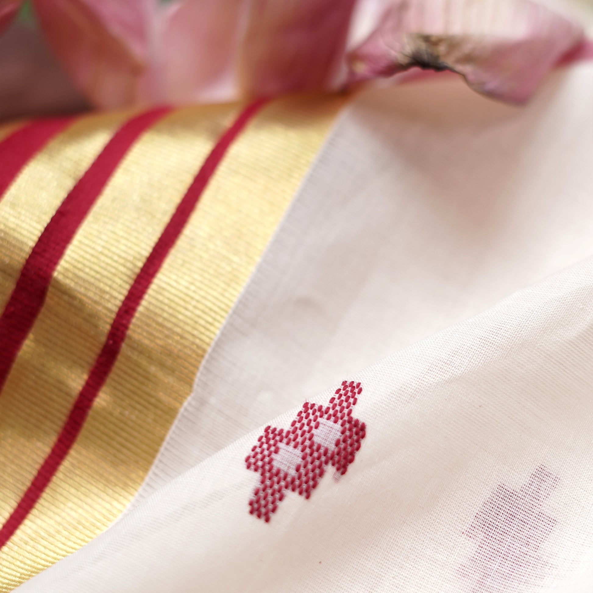 Shop Kasavu White Saree with Red Arai-maadam Motif for a traditional look