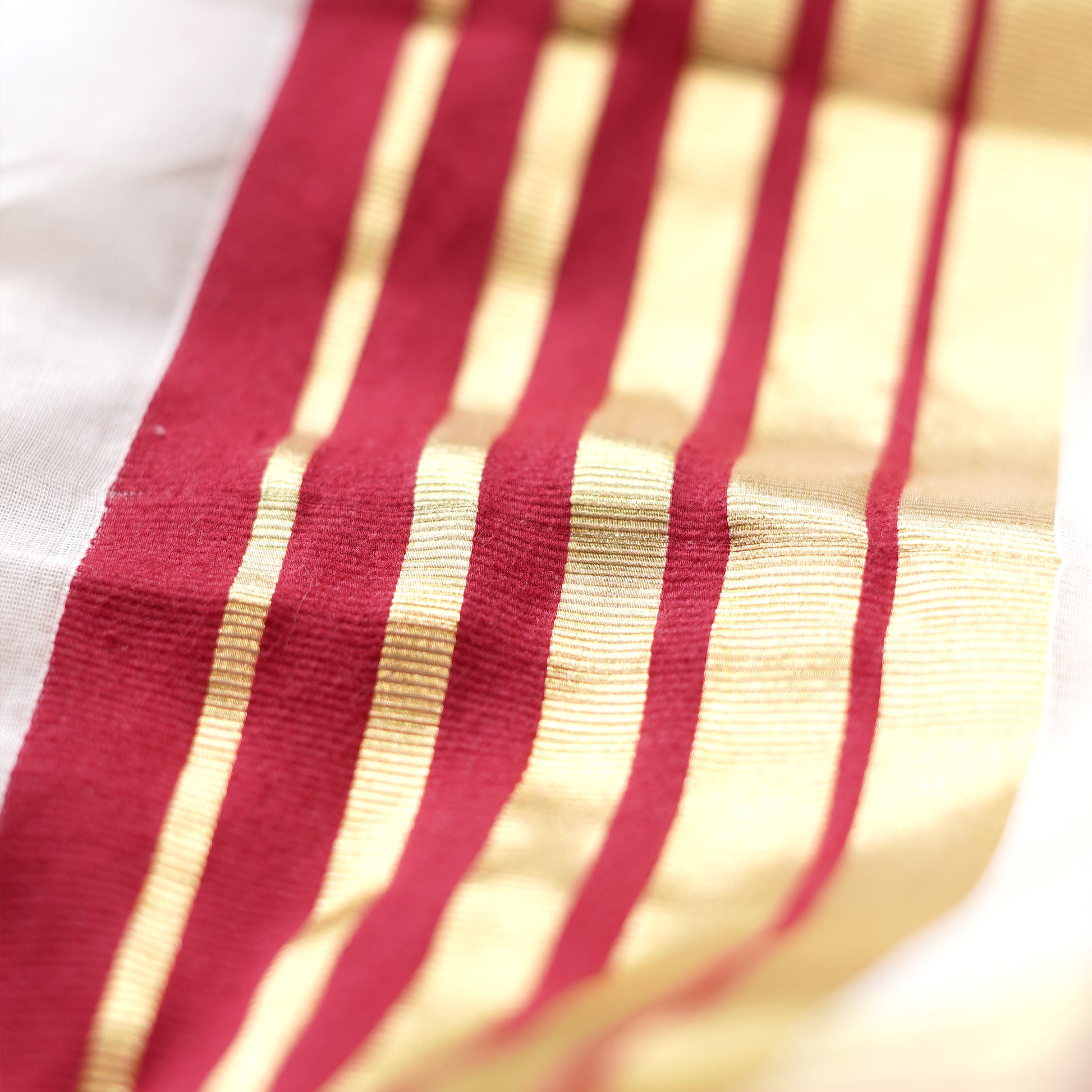 Shop Kasavu White Saree with Red Arai-maadam Motif for a traditional look