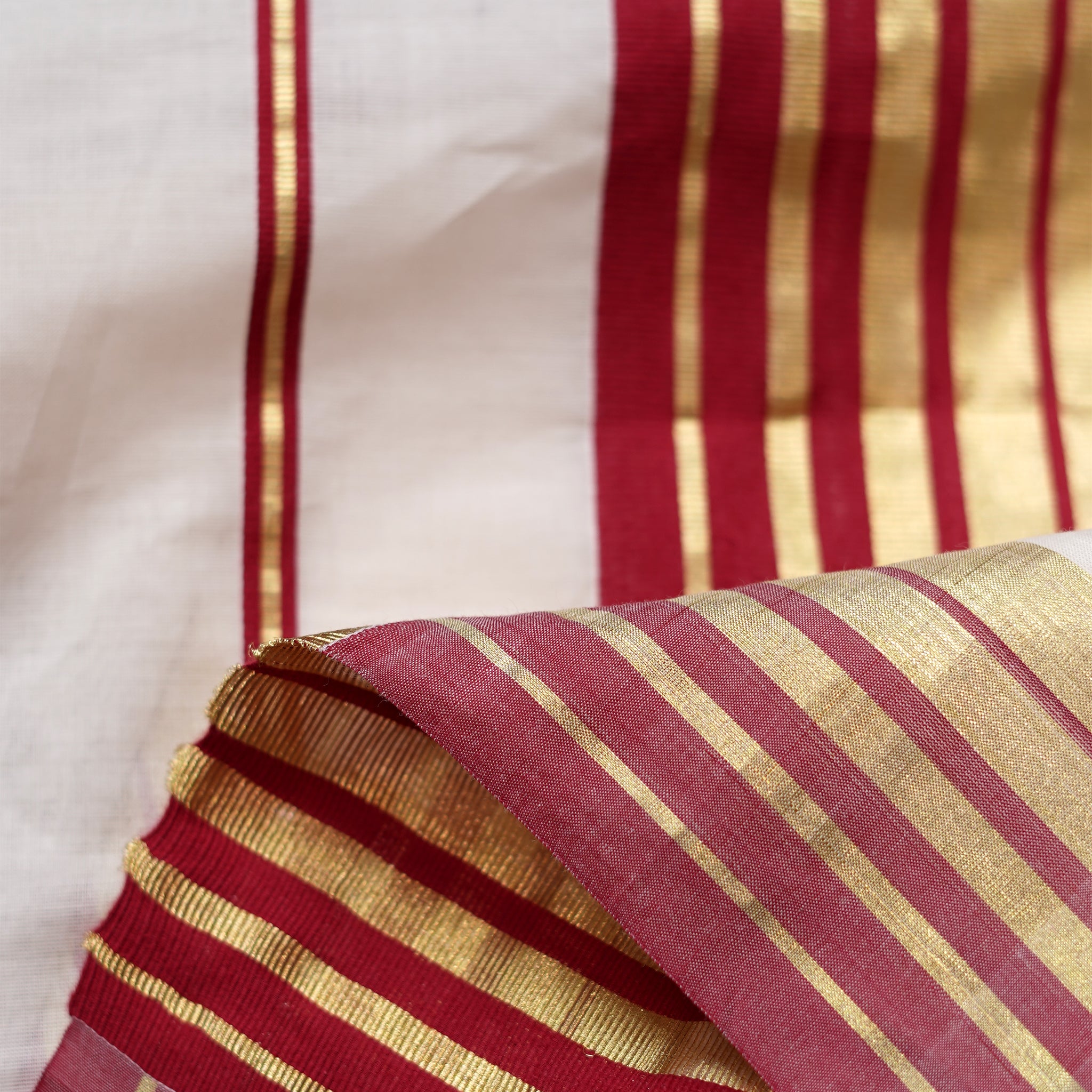 Shop Kasavu White Saree with Red Arai-maadam Motif for a traditional look