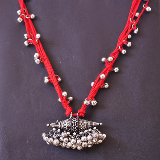 Vibrant Red Thread Neckpiece with Silver Bell Beads and Oval Pendant