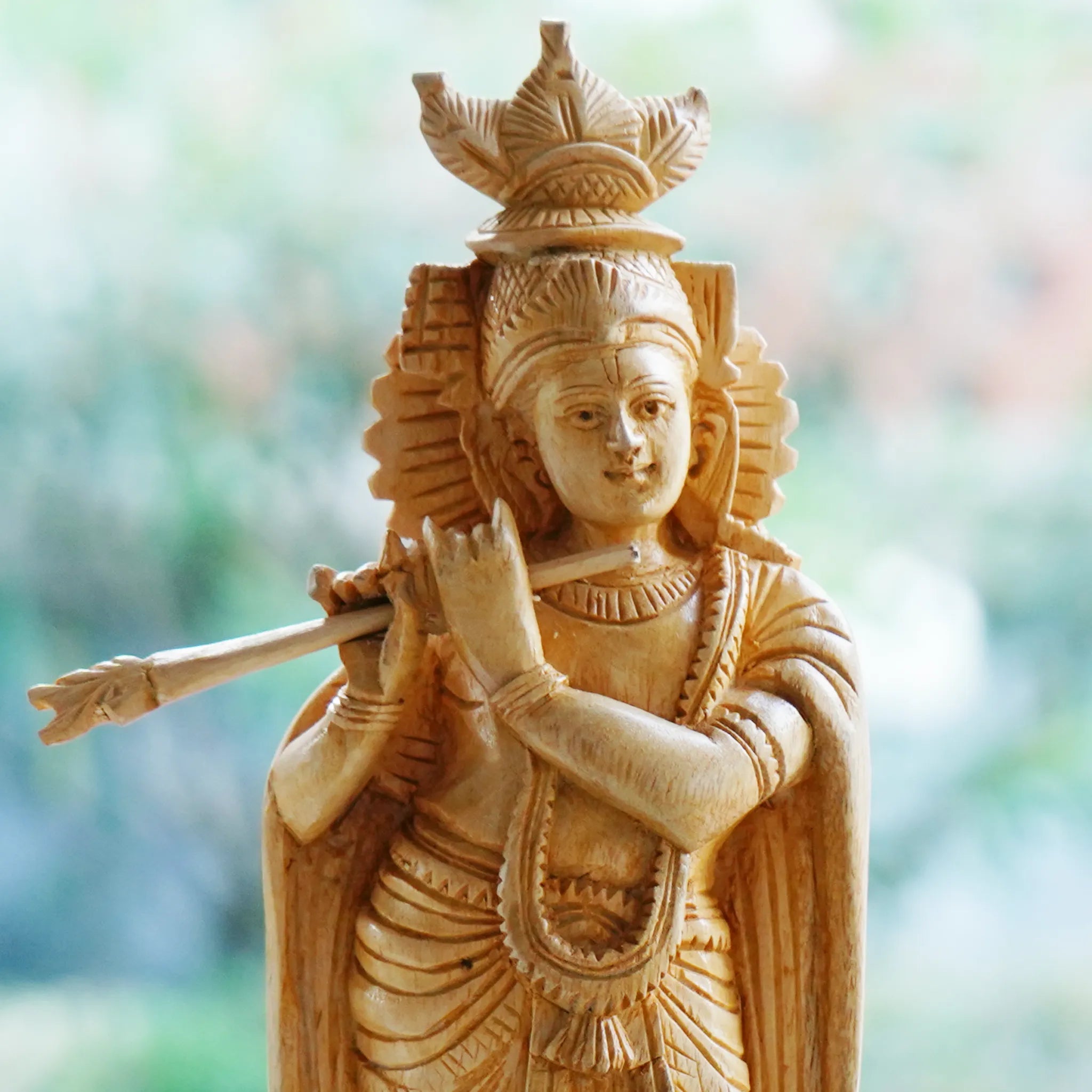Krishna with flute statue, carved from white wood 