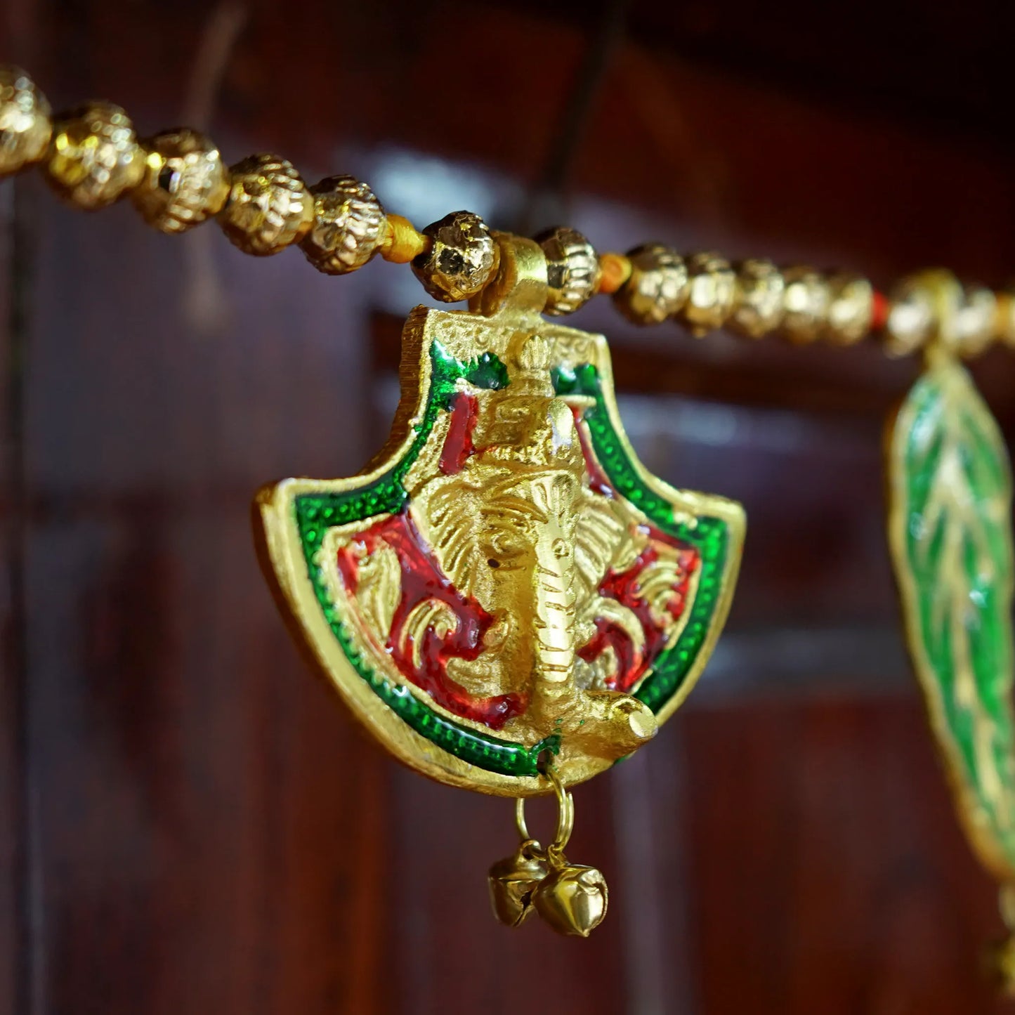 Hand Fan shaped Toran with Ganesh and Leaf