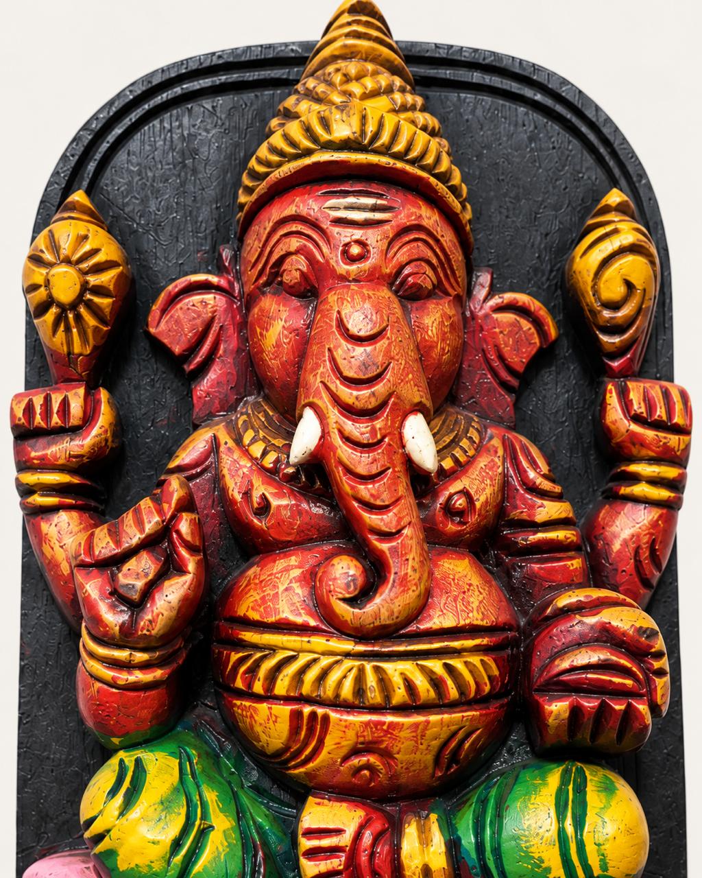 Close-up of traditional hand-painted detailing on Ganesha wood carving